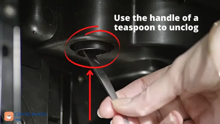 Use the handle of a teaspoon to unclog the coffee funnel